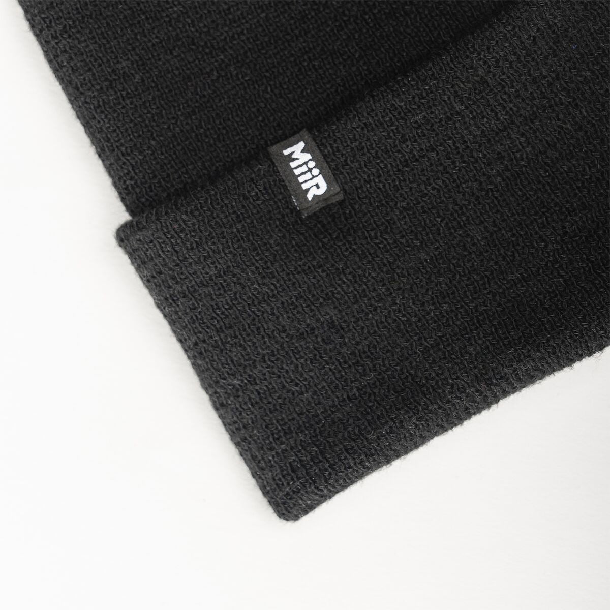recycled-poly-fine-knit-beanie-r3 WebPDP-RecycledPolyFineKnitBeanie_Studio_TagDetail_Black__BNE005002OS.jpg